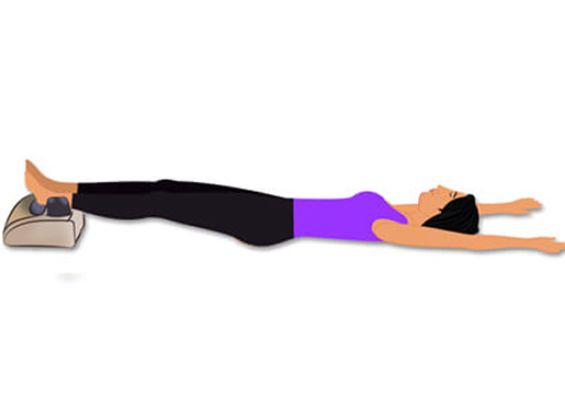Woman in the Total Release posture, encircling the head with her hands to promote deep relaxation and stress relief during Morning Walker use.